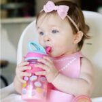 Nuby Thirsty Kids Flip-it Freestyle On the Go Water Bottle with Bite Resistant Hard Straw Cup and Easy Grip Band, Pink Donuts, 12 Ounce - Image 5