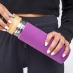 Apana Bottle Hot and Cold Detox Tea Infuser Glass Bottle With Protective Silicone Sleeve Bamboo Lid Top With Handle 18.5 Oz (555 ML) Perfect For On The Go Portable Use (Purple, 18.5 OZ) - Image 3